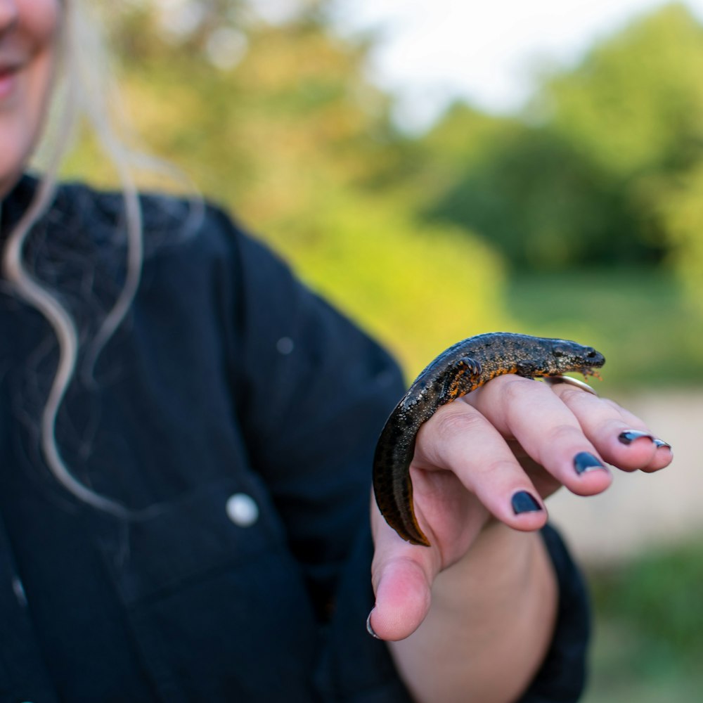 a man holding a snake