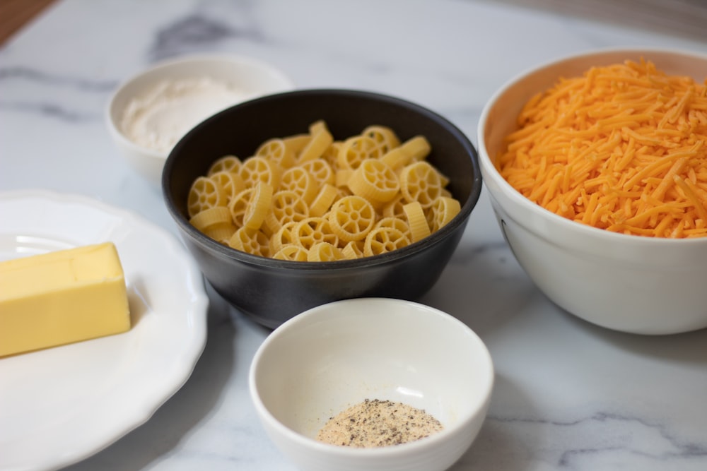 a group of bowls with food in it