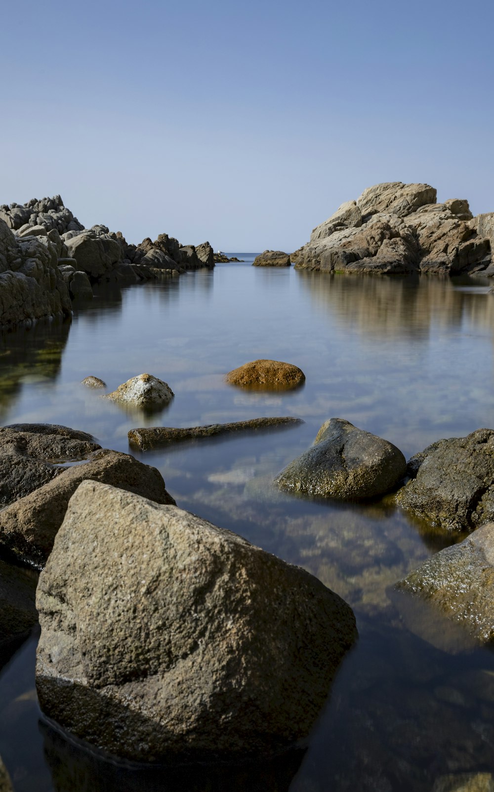 a group of rocks in a body of water