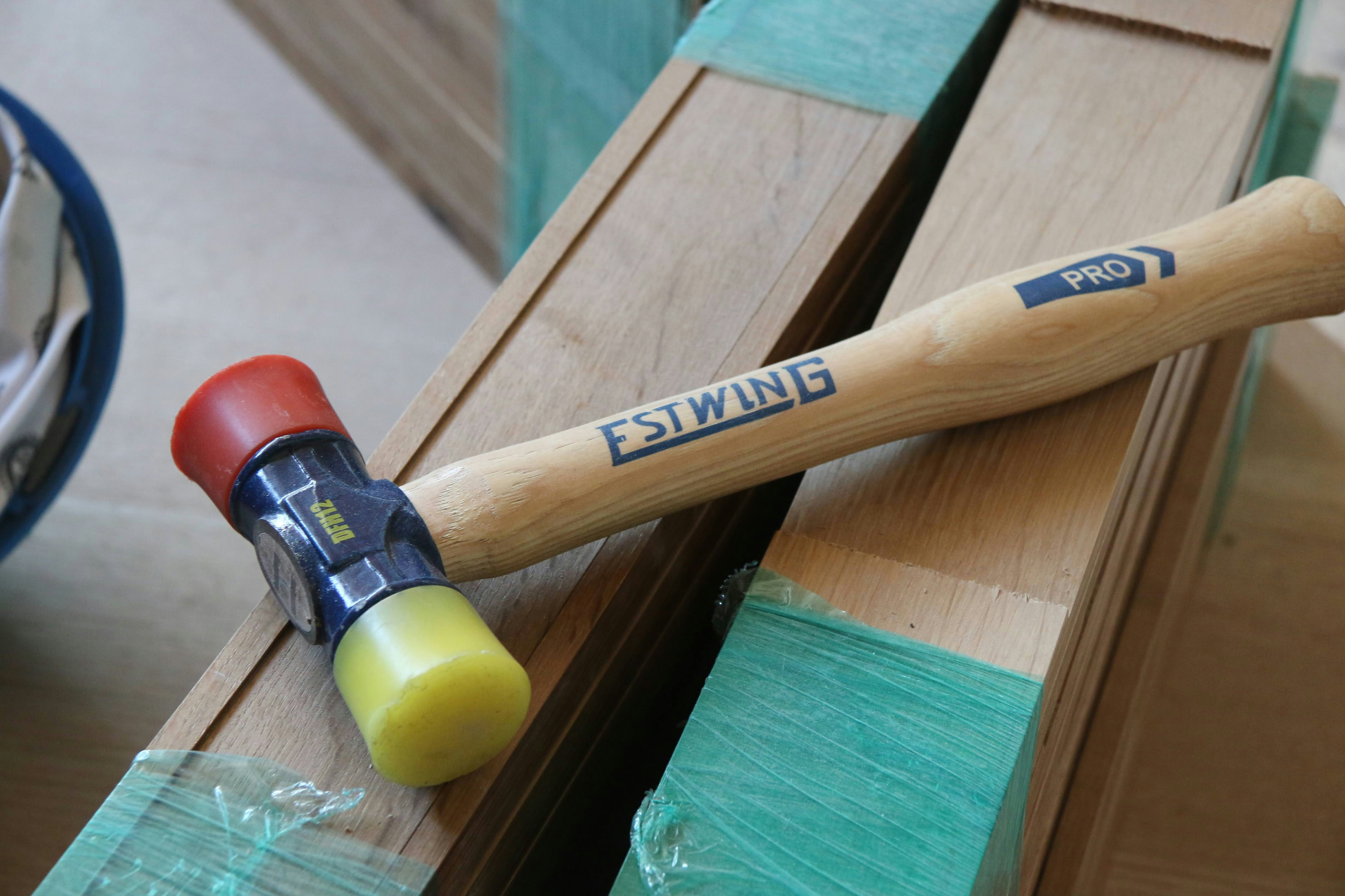 a wooden hammer on a table