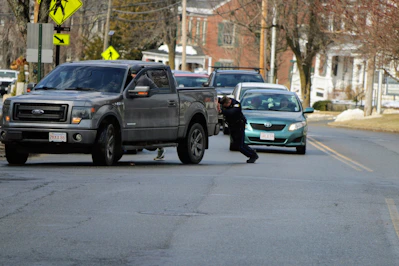 a person pushing a car