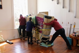a group of people working on a horse