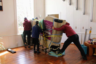 a group of people working on a horse