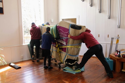 a group of people working on a horse