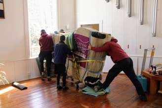 a group of people working on a horse