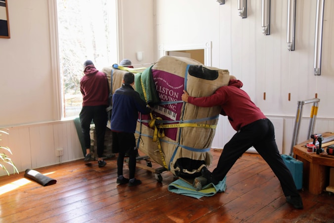 a group of people working on a horse