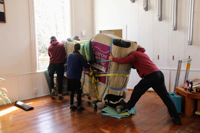 a group of people working on a horse