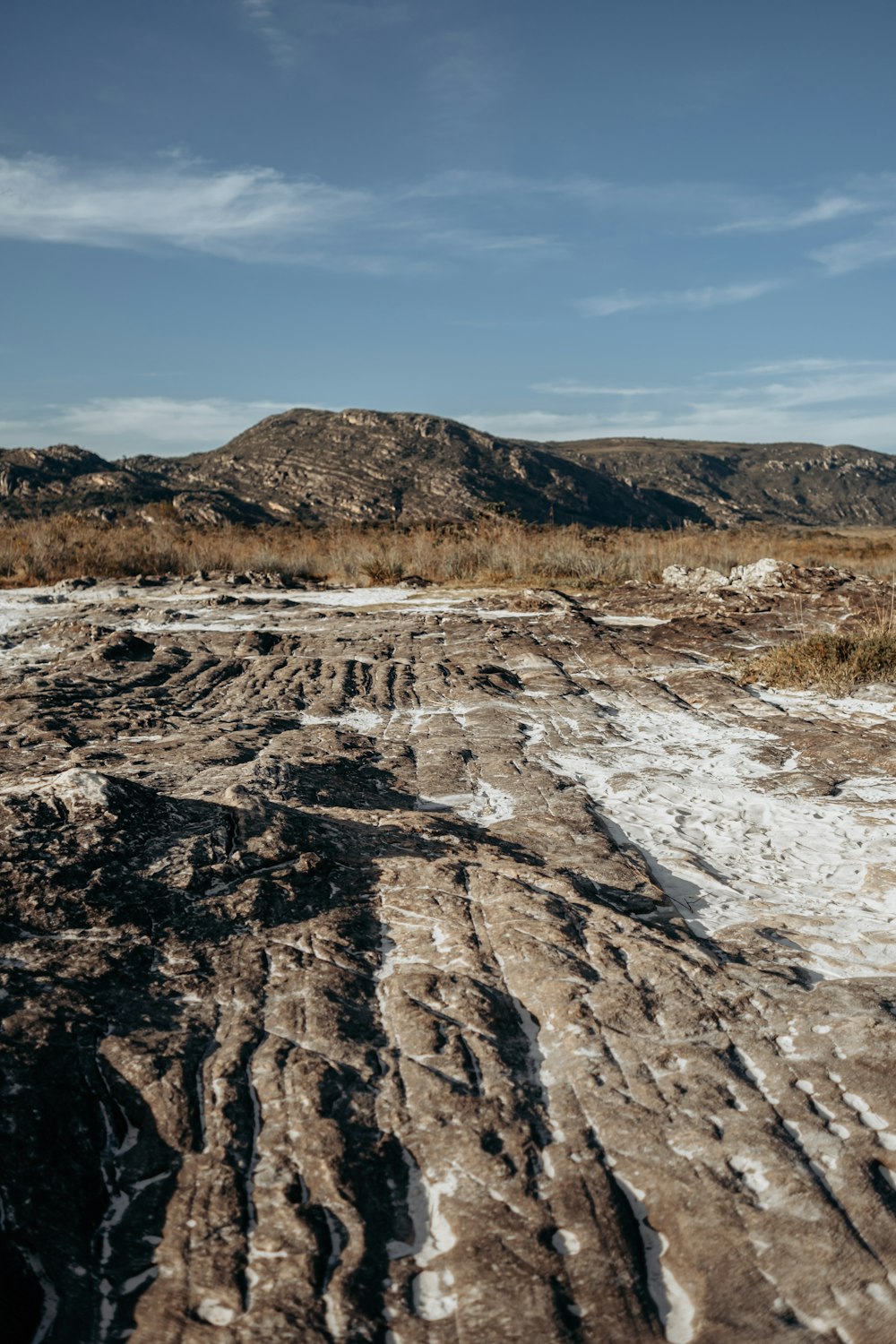 a rocky landscape with a river running through it