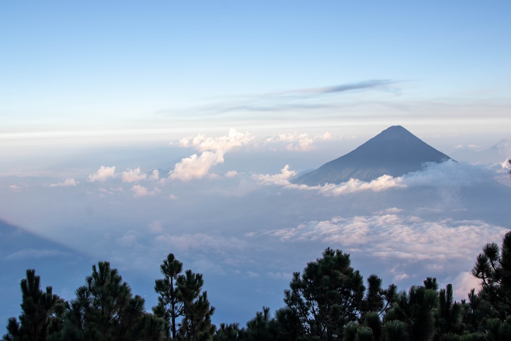 a mountain above the clouds