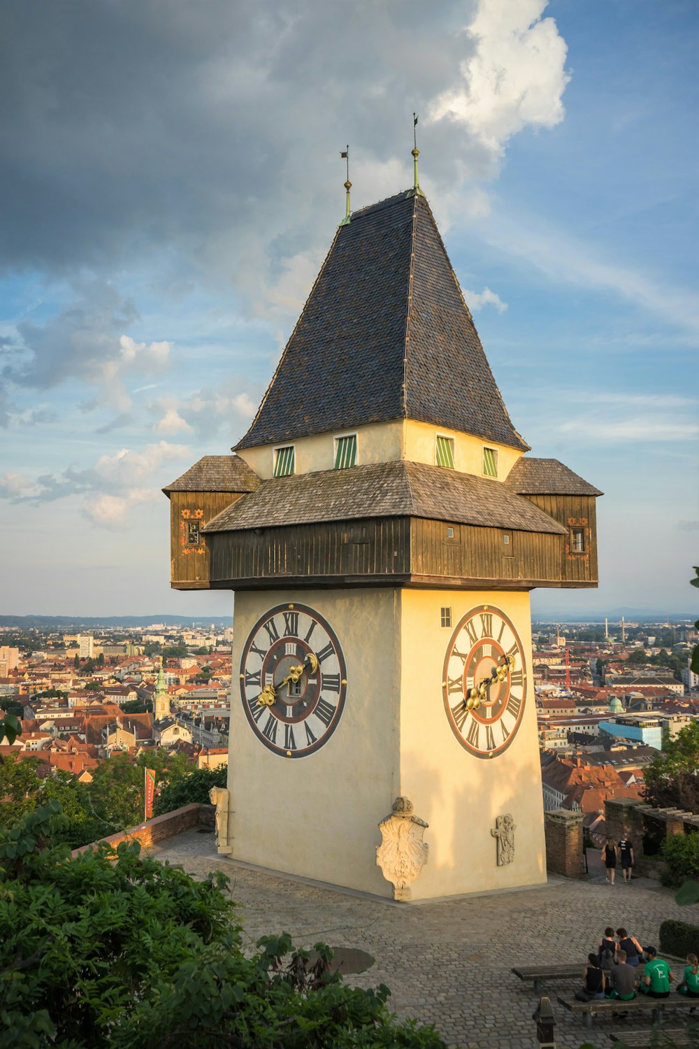 a clock tower with a weather vane