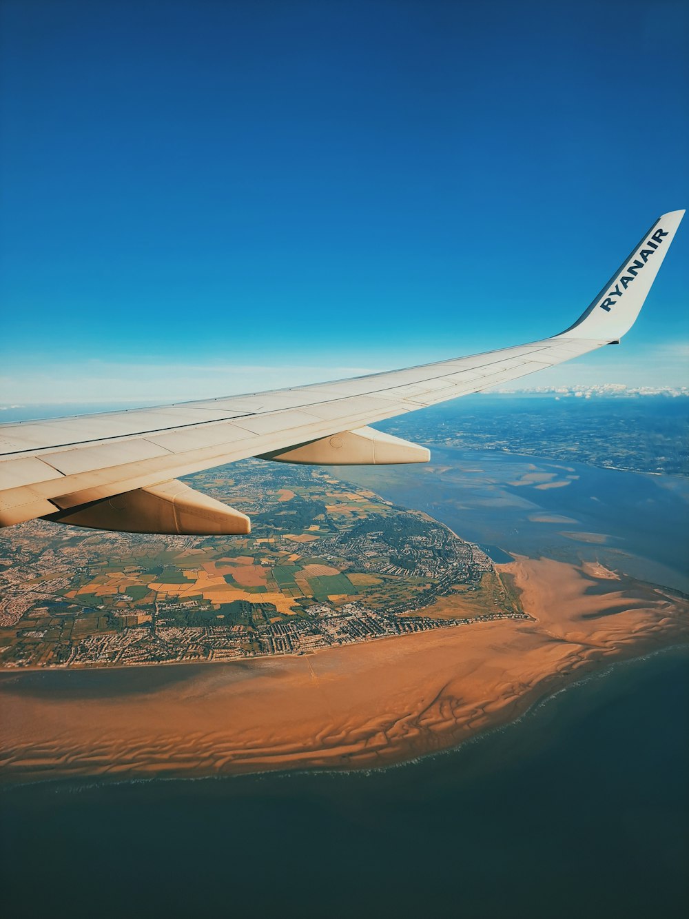 an airplane wing in the sky