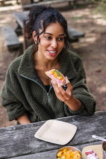 A woman enjoying a healthy meal outdoors.