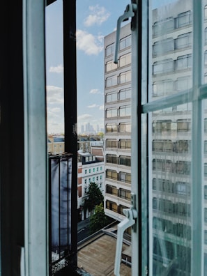 Window view from the office showing a peaceful urban street in Curitiba.