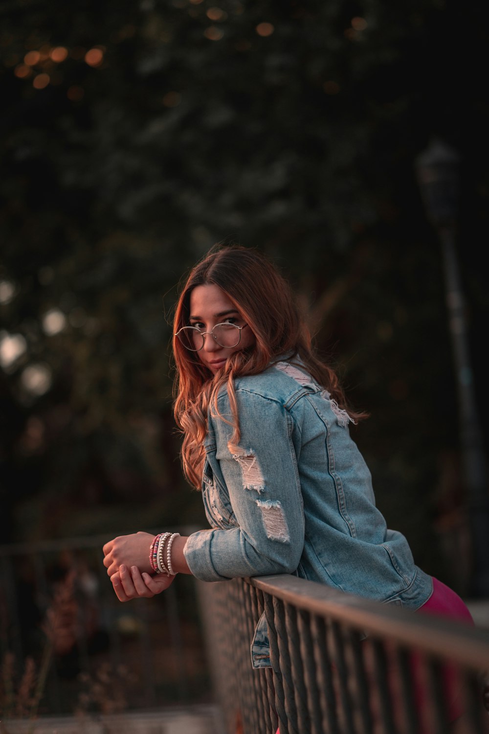 a woman sitting on a bench