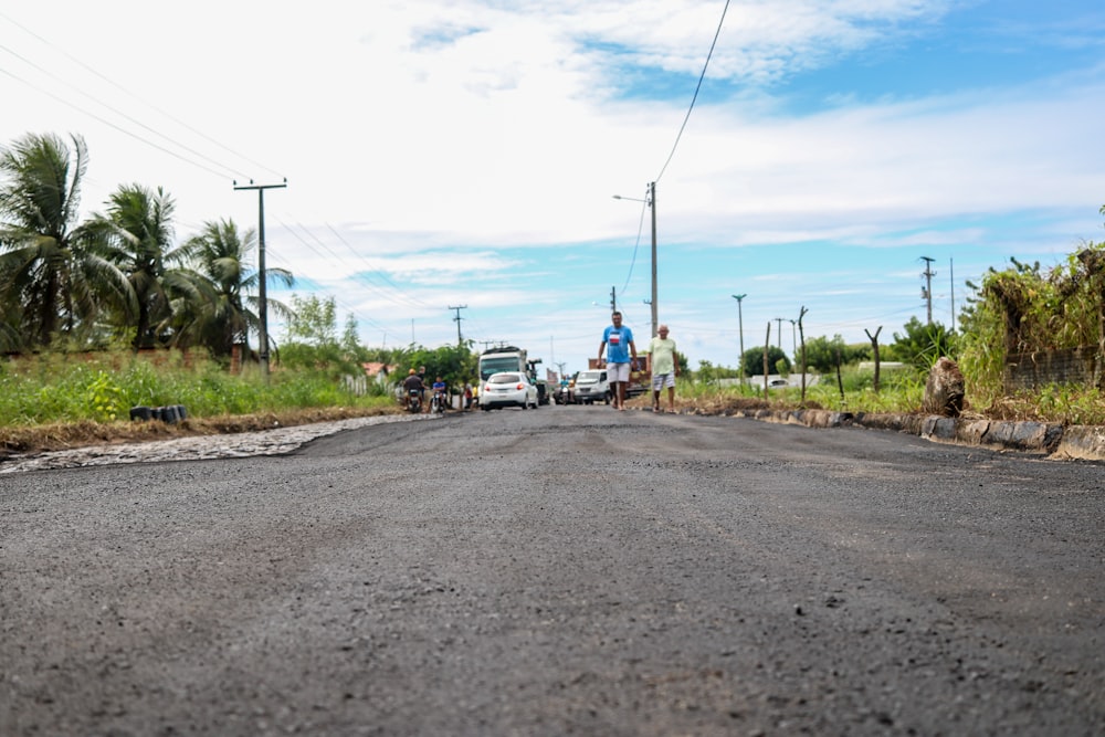 a group of people walking on a road