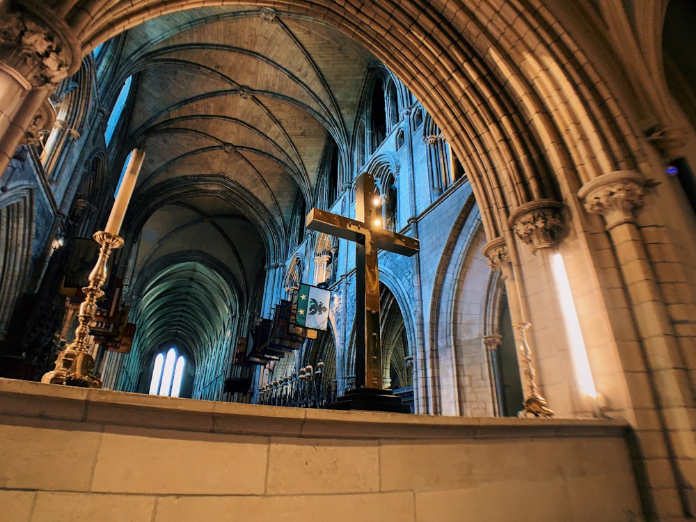 a large arched ceiling with a statue in the middle