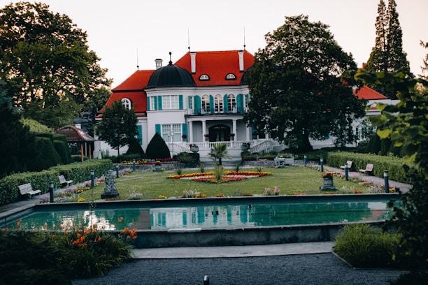 elegant estate with a pool and landscaped garden