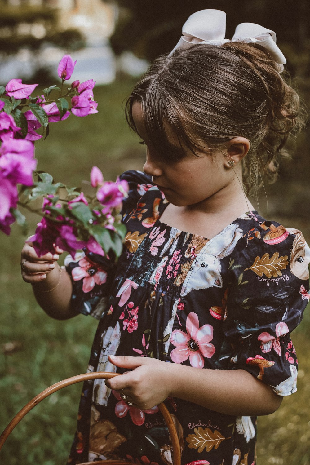 a girl smelling flowers