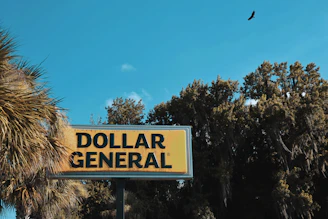 a yellow sign with black text