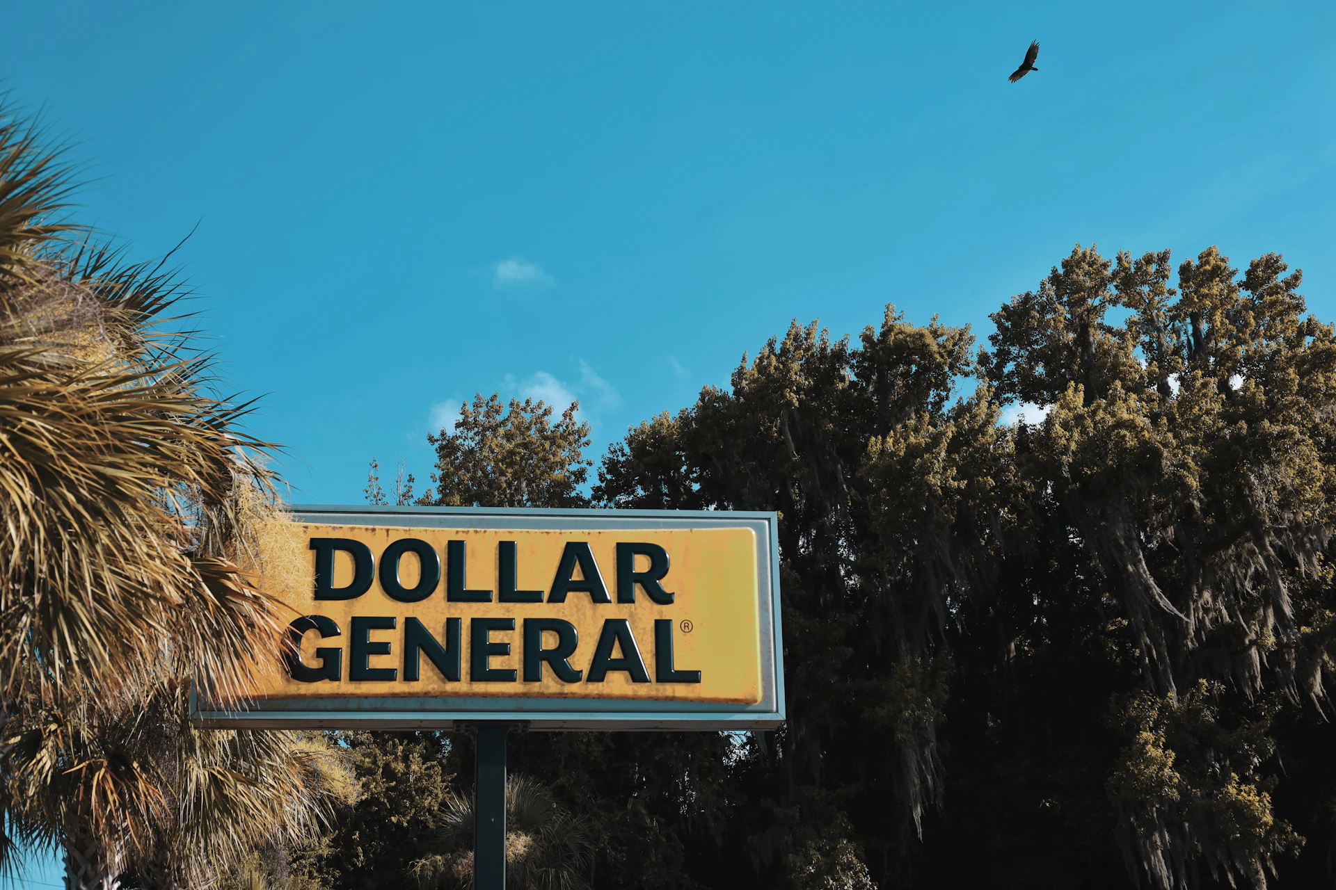a yellow sign with black text
