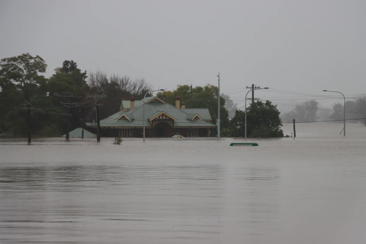 A house standing in floodwater after heavy rain