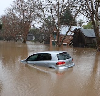 a car driving through a flooded street