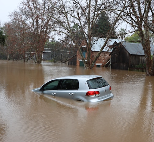 a car driving through a flooded street