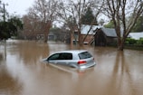 a car driving through a flooded street