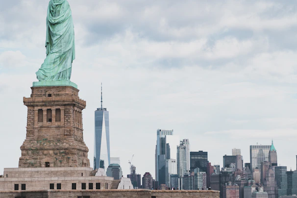 Close-up of a famous landmark statue in the heart of a bustling city.