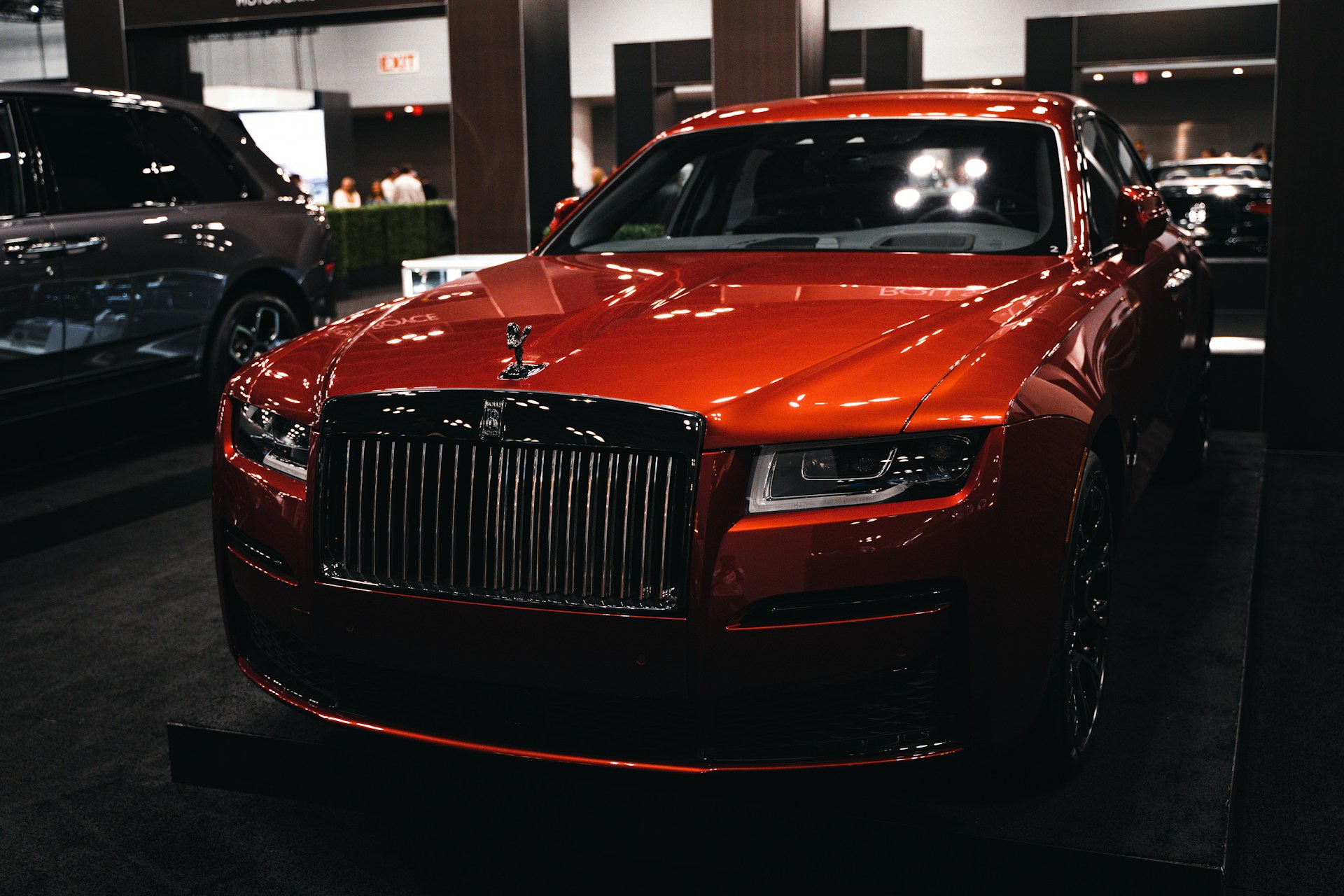 a red car parked in a showroom