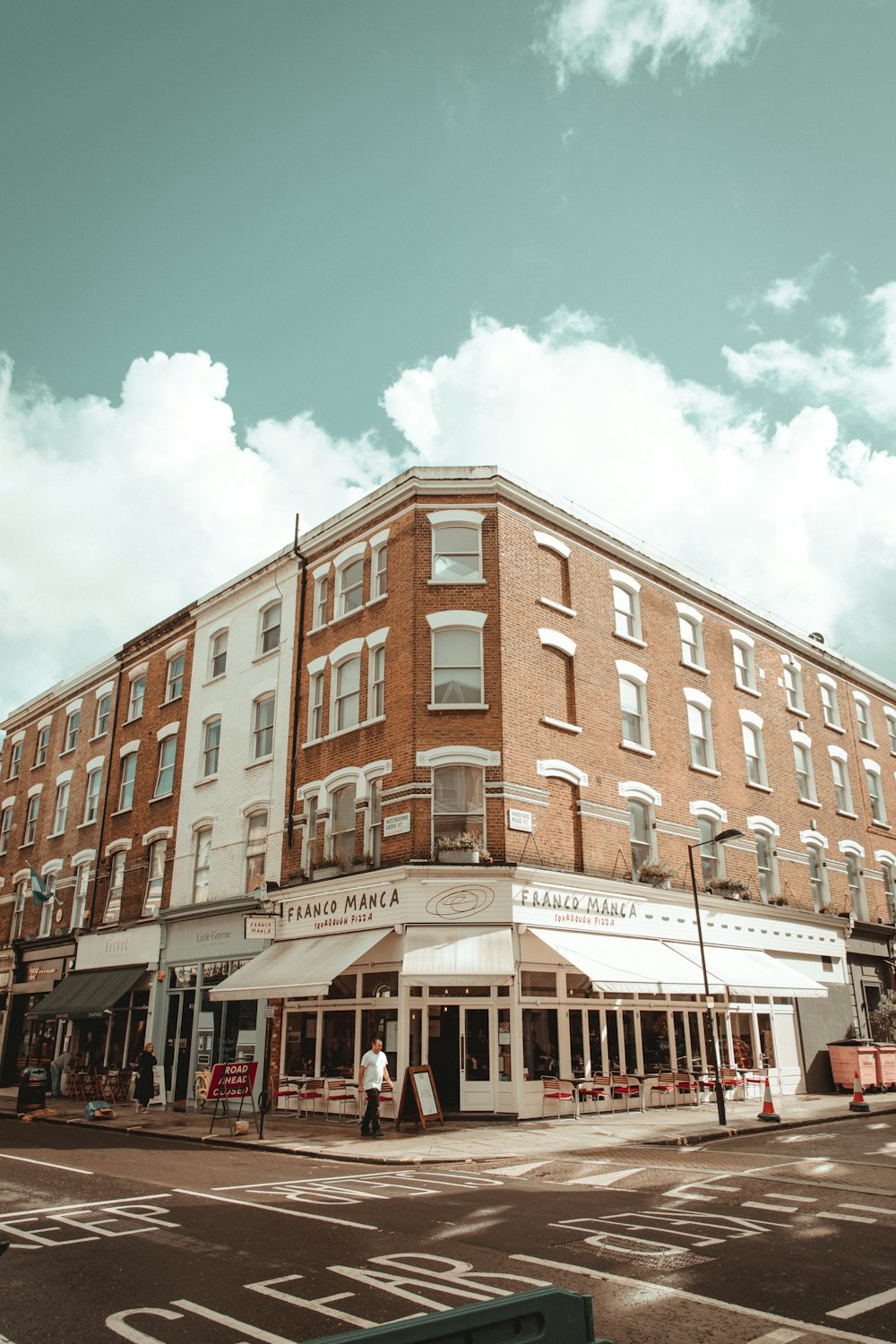 a large building with a street in front of it