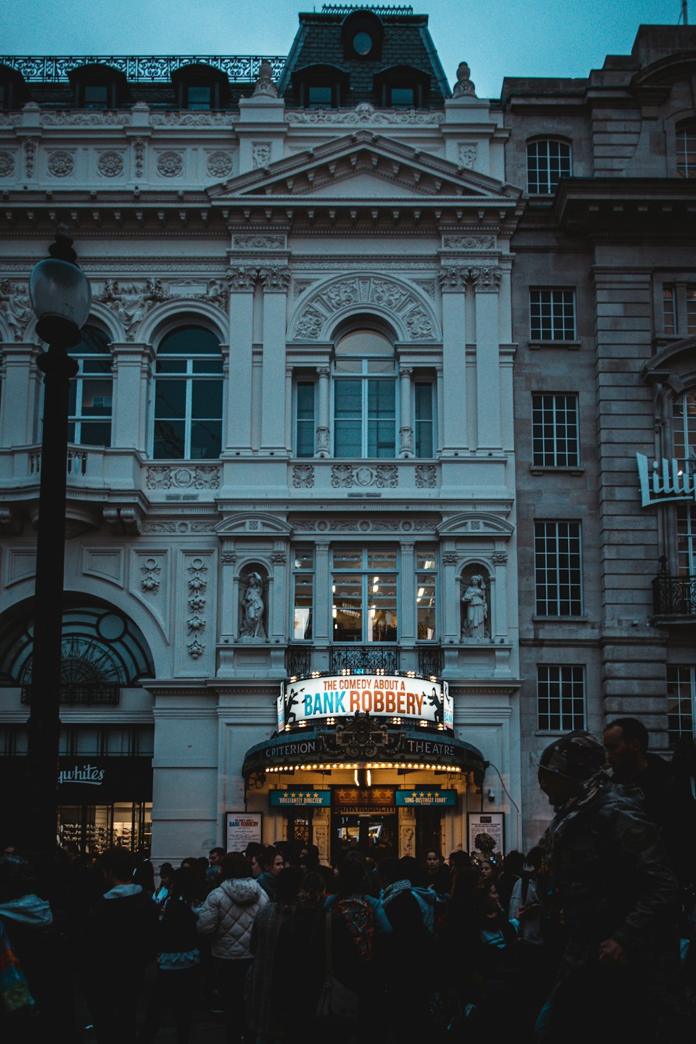 a crowd of people outside of a building