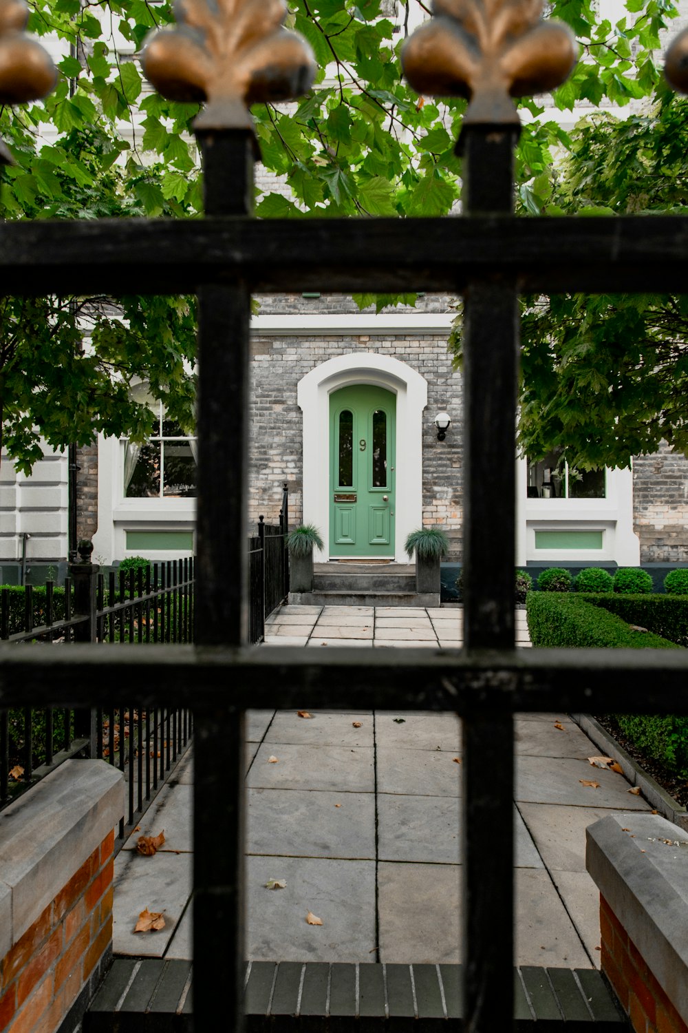 a porch with a green door