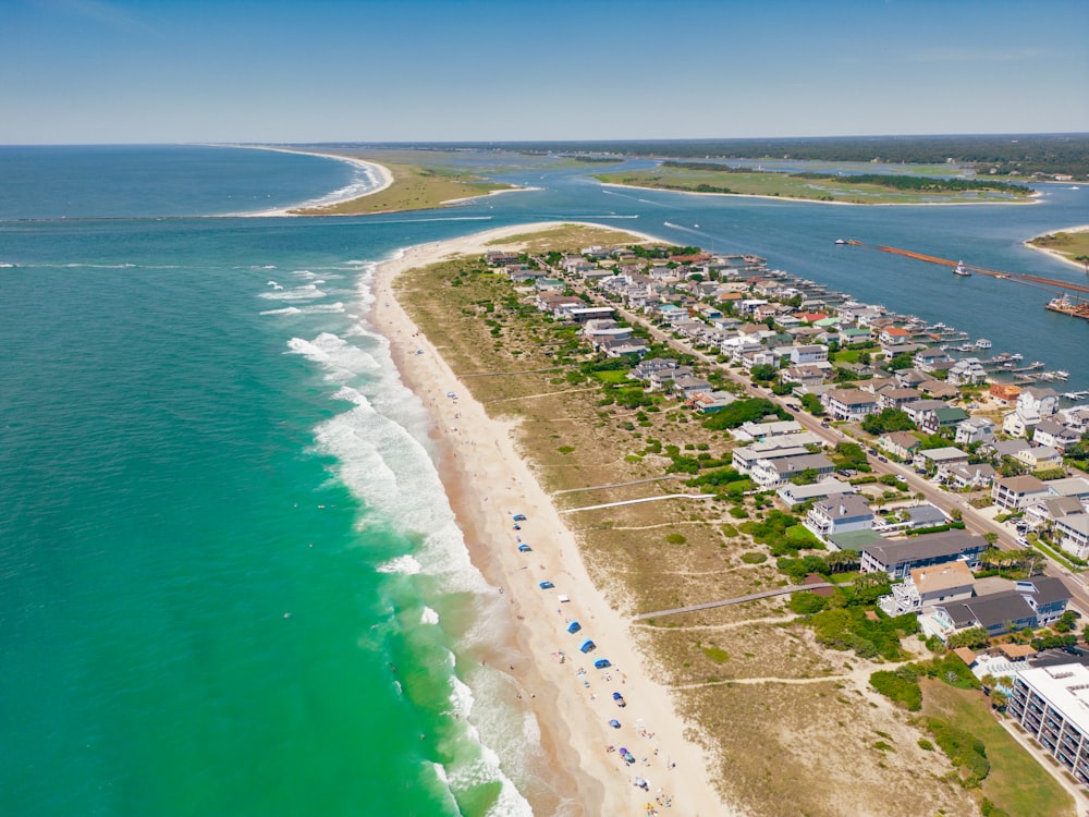 a beach with houses and water