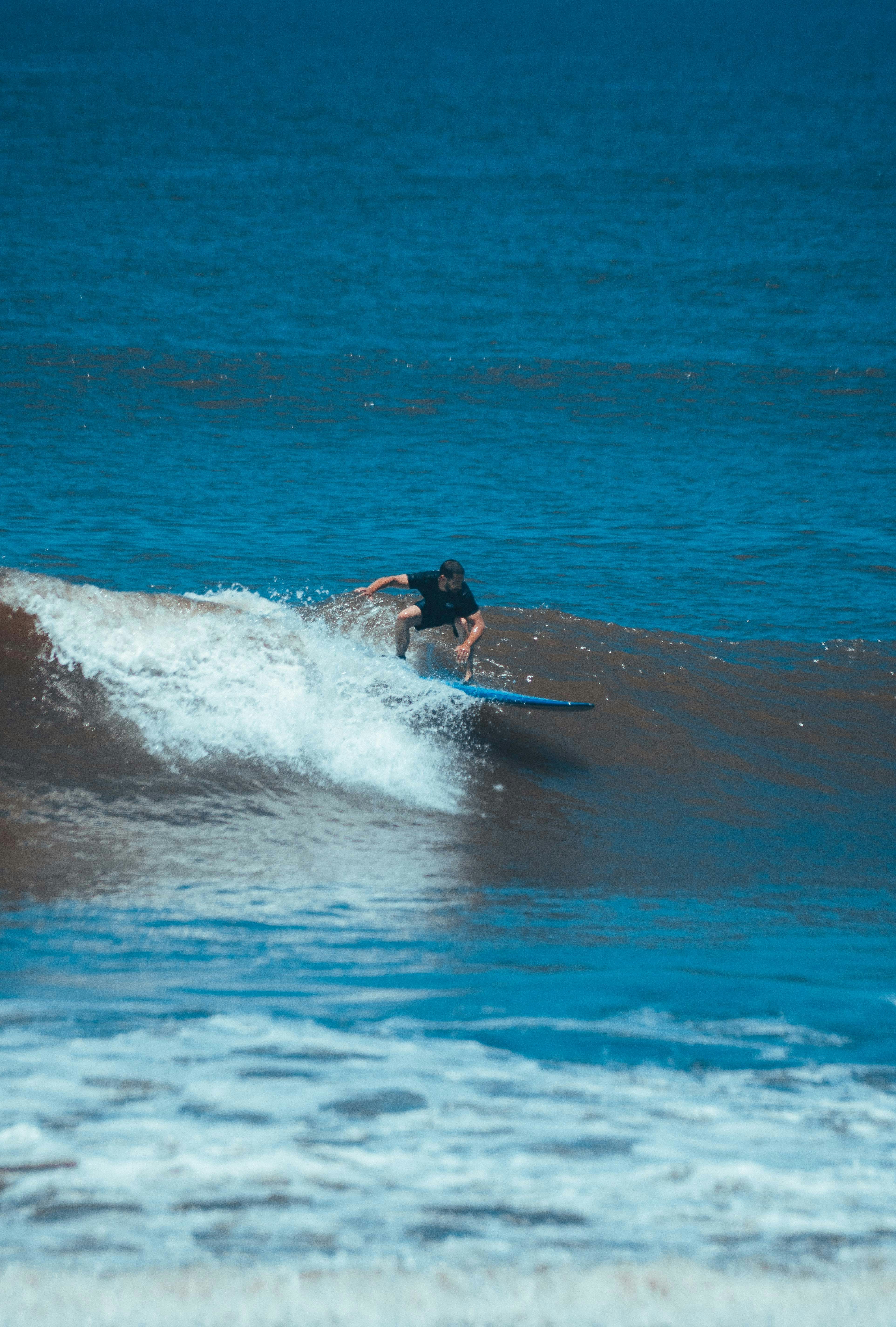 a person surfing on the waves