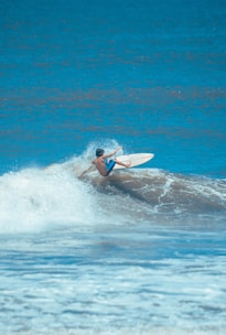 a man surfing on the waves