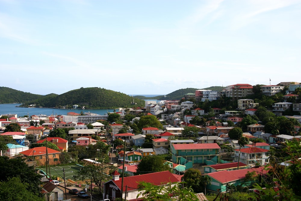 a city with red roofs by the water