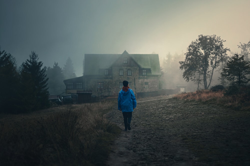 a person walking on a dirt road