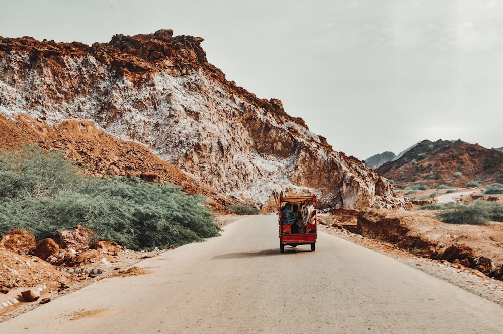 a truck driving down a road