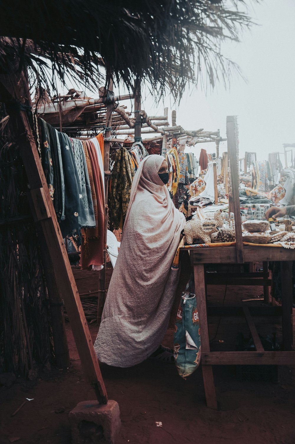 a person in a robe standing outside