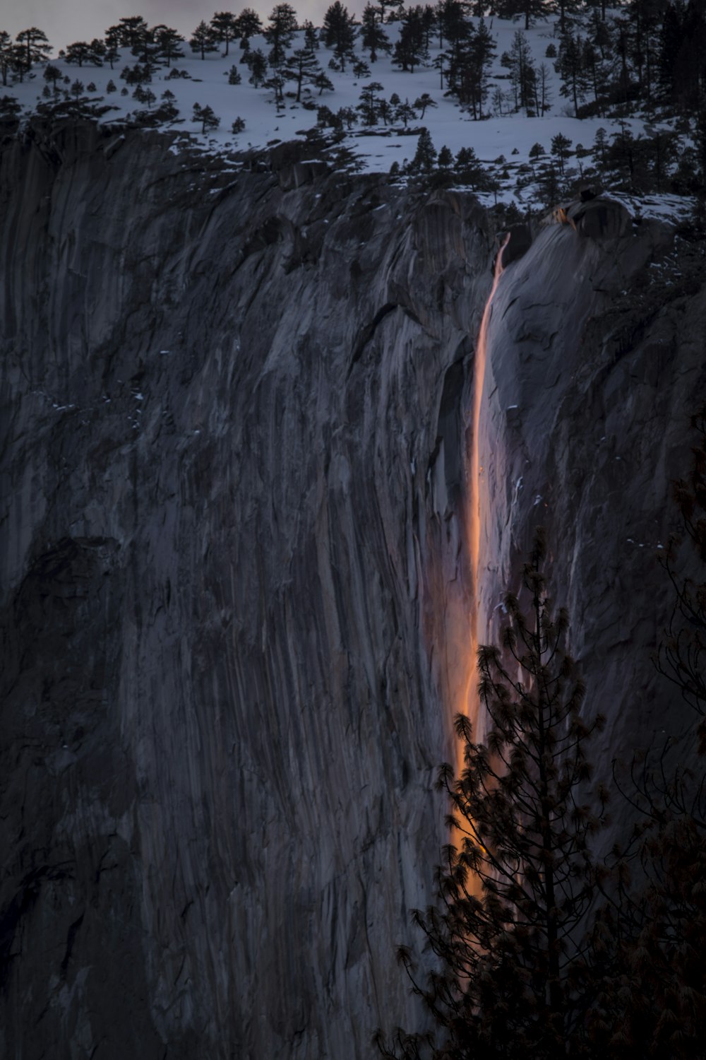a large waterfall with a red line