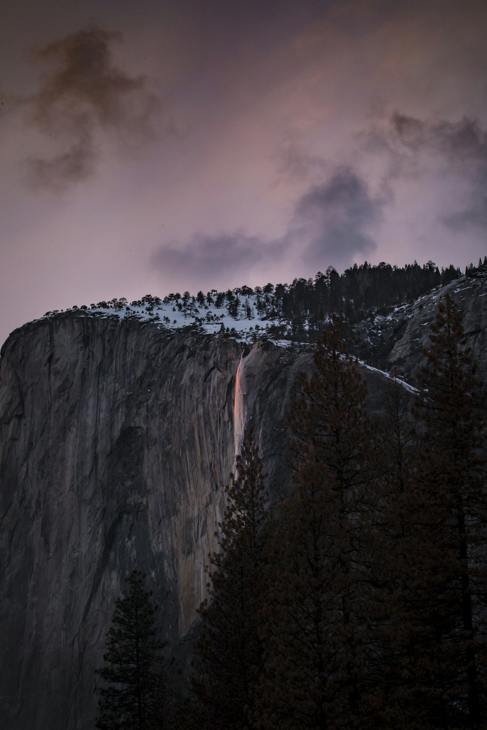 a waterfall in a mountain