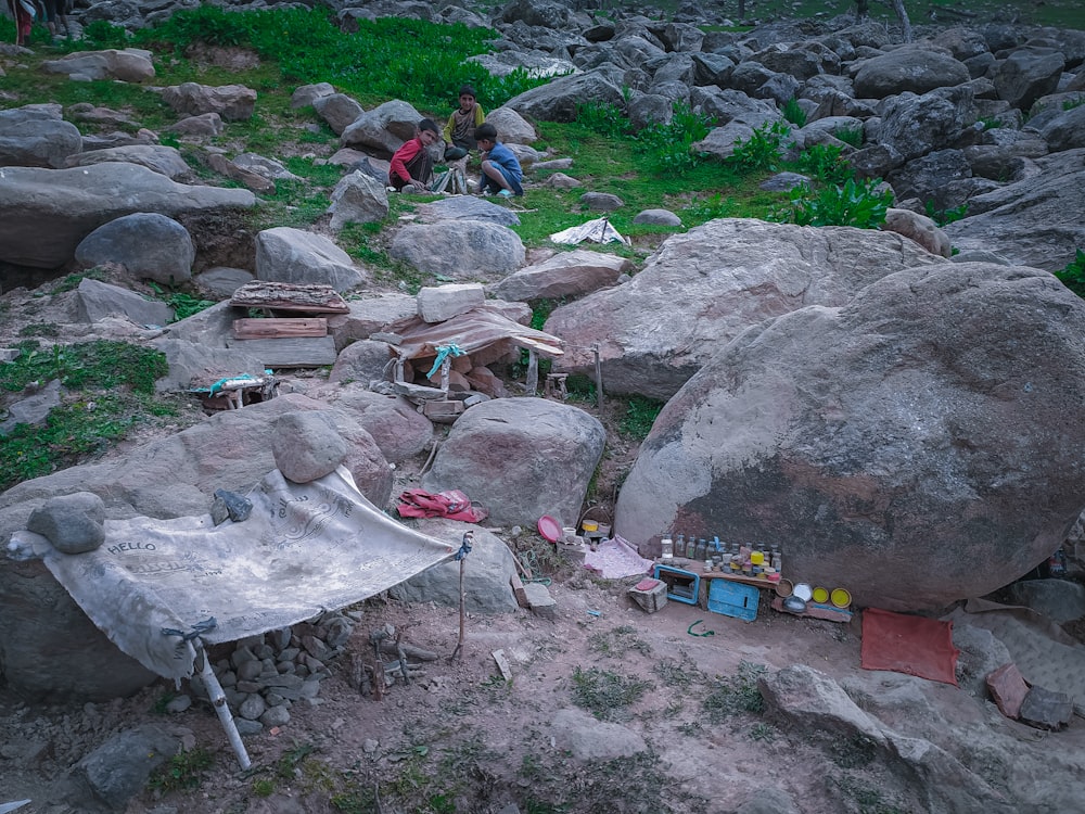 people sitting on rocks