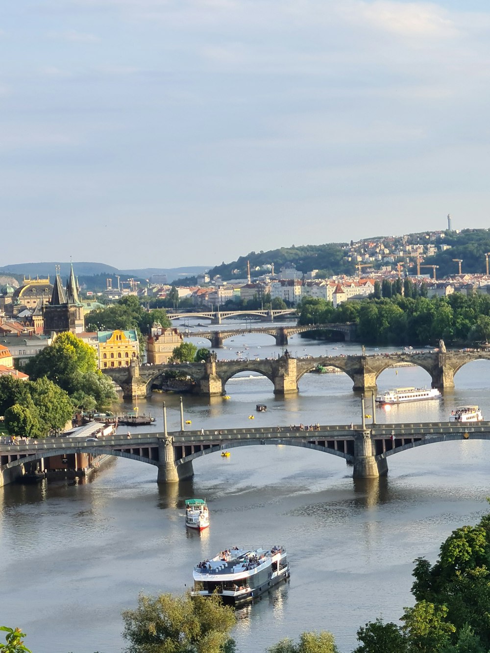 a bridge over a river with boats