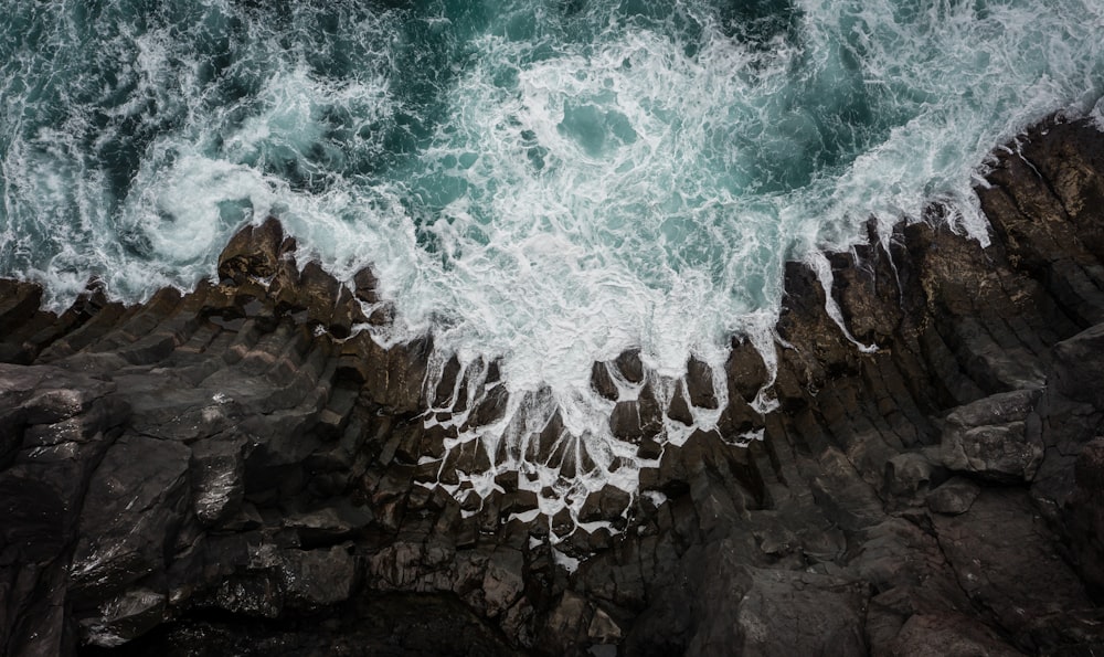 a rocky cliff with water