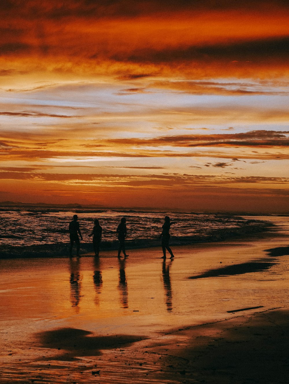 a group of people on a beach