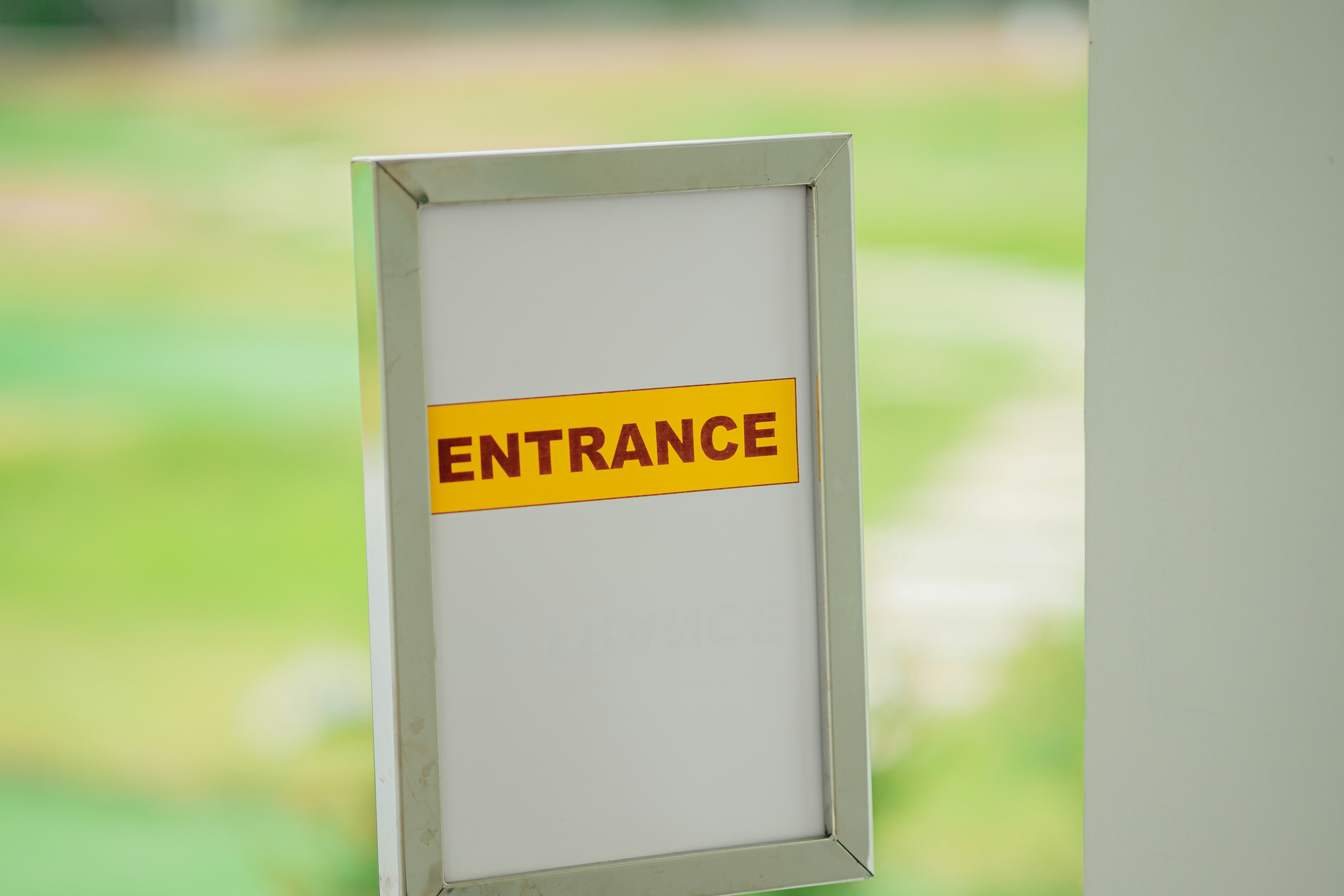 A white rectangular object with a red and black sign on it photo – Free ...