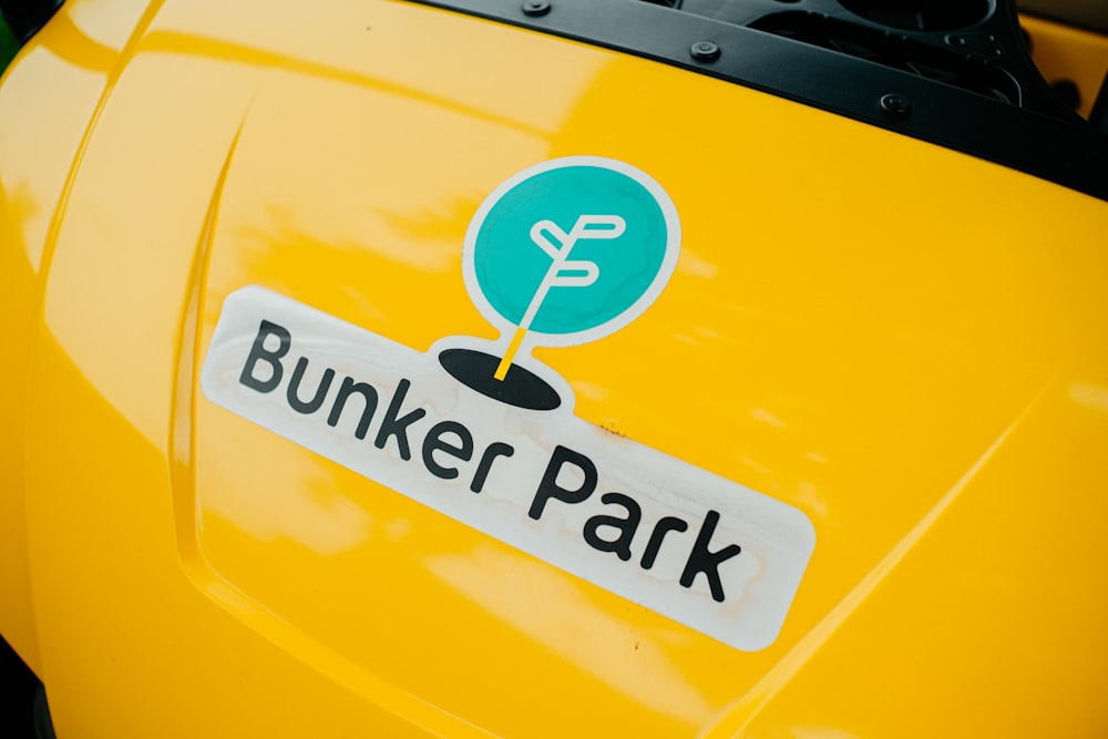 a yellow car with a logo