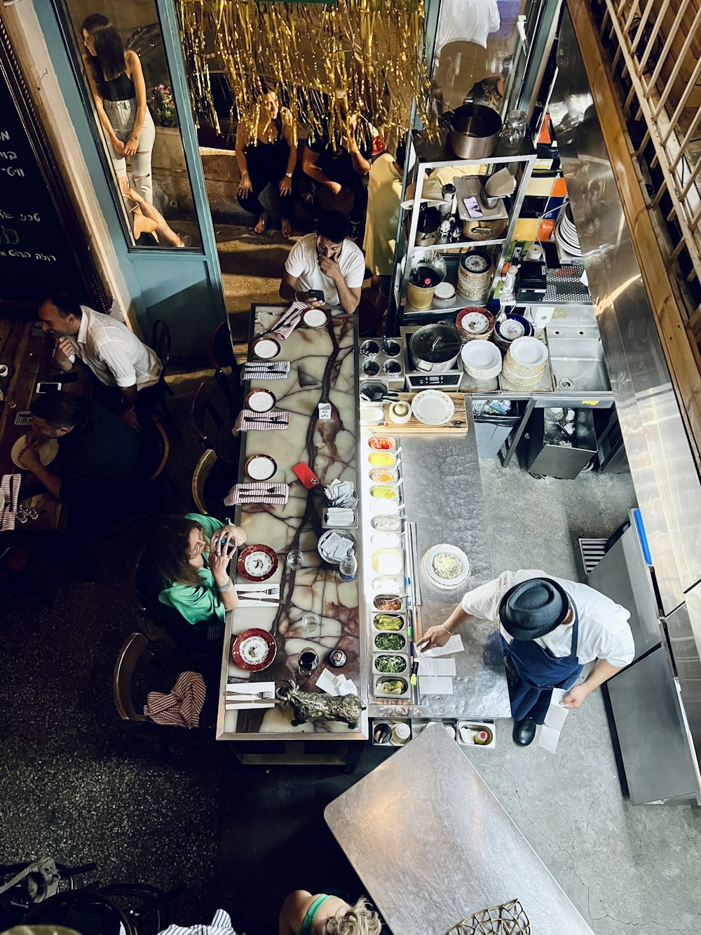 a group of people working in a room with many bottles