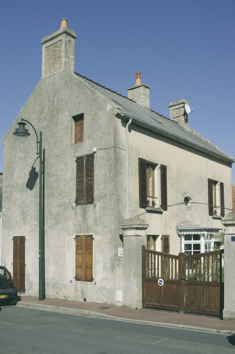 a white building with a fence